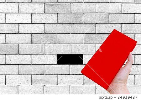 worker hand hold construction brick isolated worker hand hold construction brick isolated 34939437