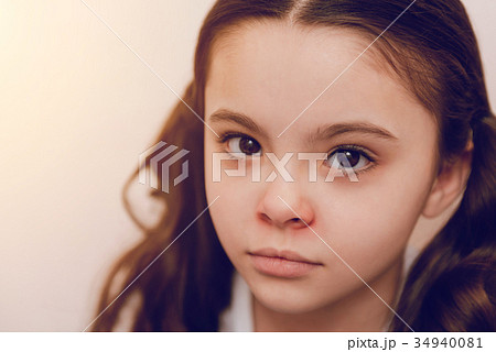 Portrait of charming kid that posing on camera 34940081