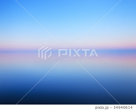 Minimalist landscape of calm water and horizon Minimalist landscape of calm water and horizon 34940614