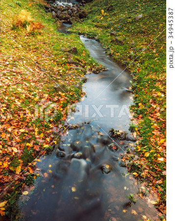 Small river in the autumn park Small river in the autumn park 34945387