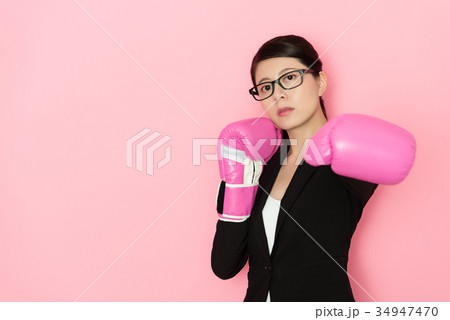 seriously female office worker face to camera seriously female office worker face to camera 34947470