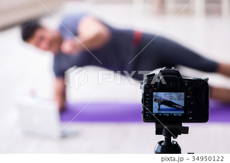 Sports and health blogger recording video in sport 34950122