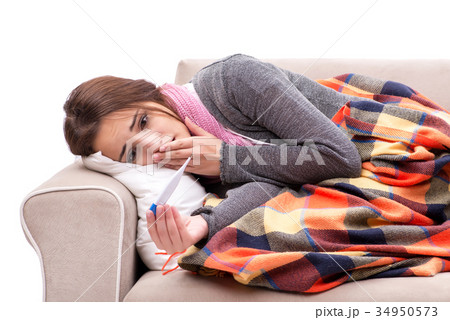 Teenager suffering from cold sitting on coach Teenager suffering from cold sitting on coach 34950573