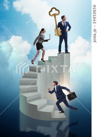 Businessman with key to success at the top of 34950656
