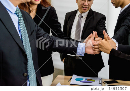 Half of the businessmen meeting for the planning meeting. Half of the businessmen meeting for the planning meeting. 34951507