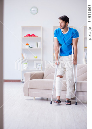 Injured young man recovering at home 34951663