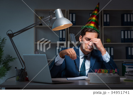 Man celebrating birthday in the office Man celebrating birthday in the office 34951741