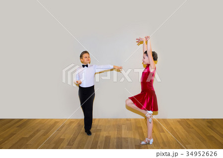 The young boy and girl posing at dance studio 34952626