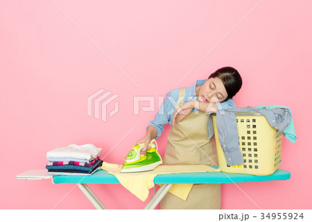 elegant woman worker standing in pink background elegant woman worker standing in pink background 34955924