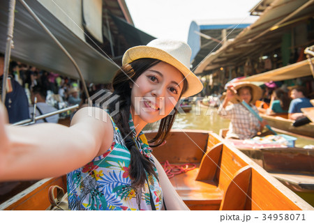 happy girl tourist taking self-portrait photo 34958071