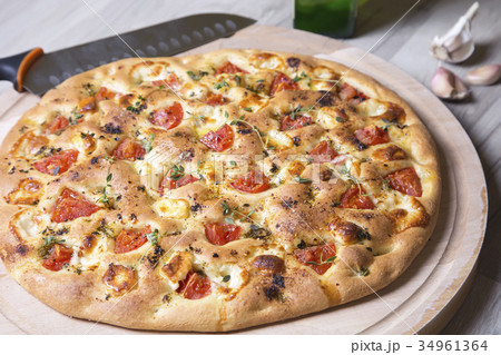 Fresh bread focaccio with cheese and tomatoes 34961364