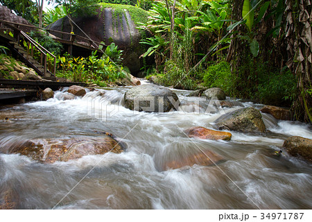 Close up little waterfall on stream at Chiangmai Close up little waterfall on stream at Chiangmai 34971787