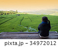Woman tourism sitting on wood balcony to see view 34972012
