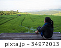 Woman tourism sitting on wood balcony to see view 34972013