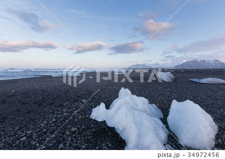 Ice on the beach over seacoast skyline, Iceland  34972456