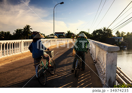 Two local women are on the way to local market Two local women are on the way to local market 34974235