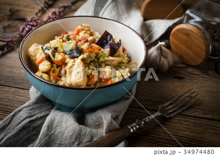 Risotto with chicken and vegetables. Risotto with chicken and vegetables. 34974480