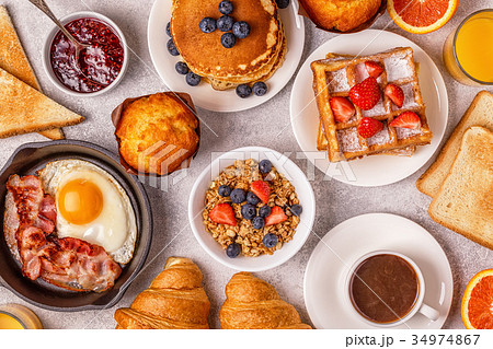 Delicious breakfast on a light table. 34974867