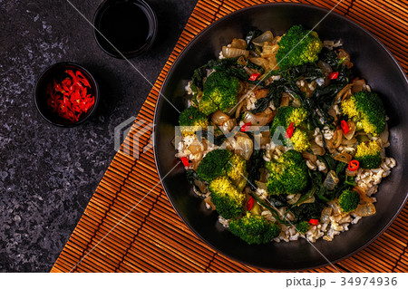 Cooking asian stir fry rice with vegetables Cooking asian stir fry rice with vegetables 34974936