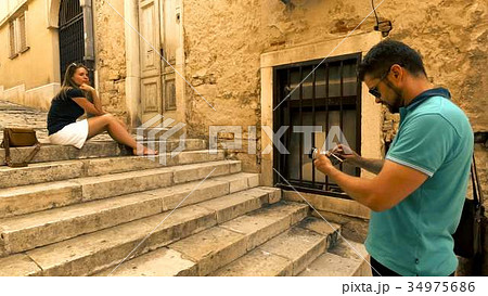 Young couple making photos on narrow Mediterranean 34975686