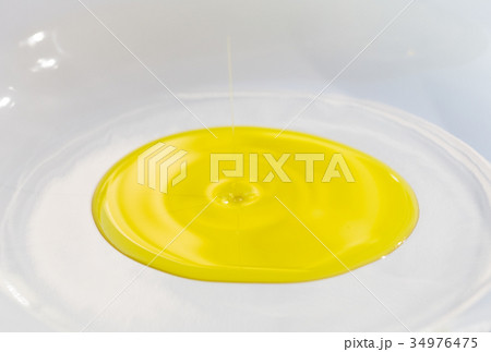 Olive oil on a plate 34976475
