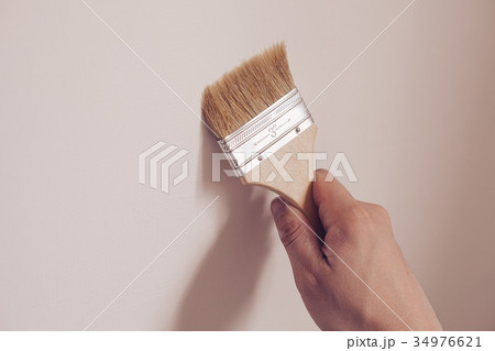 Painter painting the white wall in house Painter painting the white wall in house 34976621