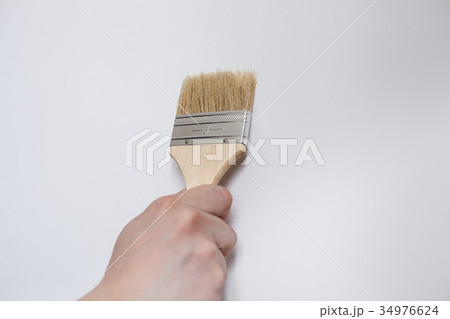 Painter painting the white wall in house Painter painting the white wall in house 34976624
