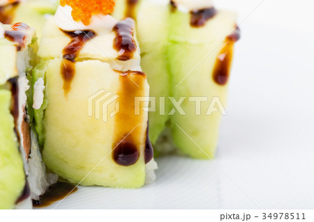 Delicious avocado sushi roll with salmon. 34978511