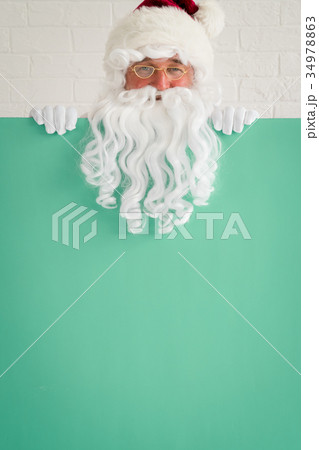Santa Claus holding banner blank Santa Claus holding banner blank 34978863
