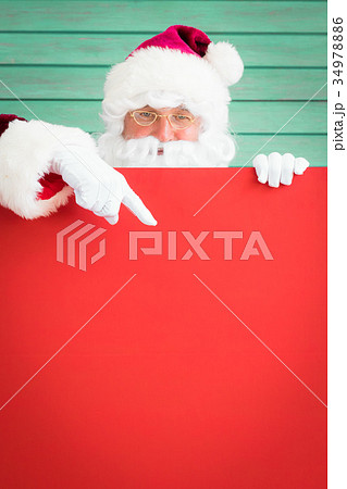 Santa Claus holding banner blank 34978886