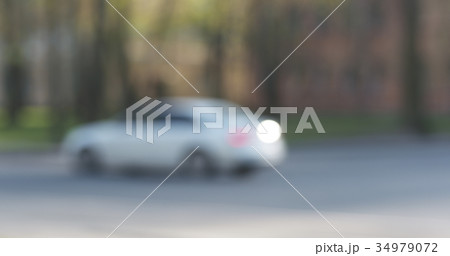 blurred background of traffic in town at daytime blurred background of traffic in town at daytime 34979072