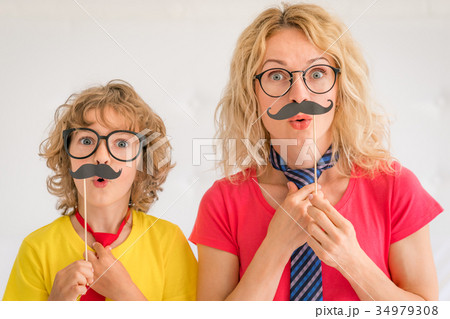 Happy family playing in home Happy family playing in home 34979308