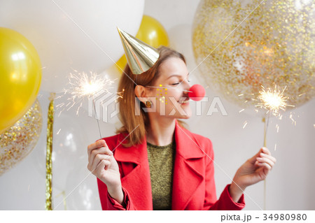 woman around at a party on background of balloon 34980980