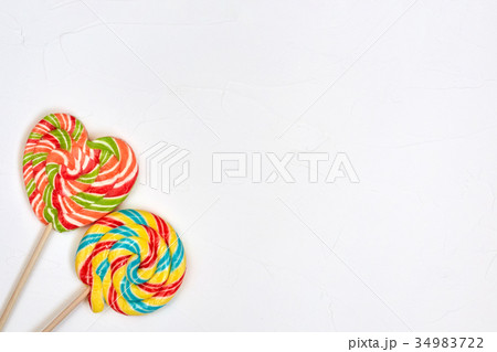 Swirl rainbow lollipop candy on white background Swirl rainbow lollipop candy on white background 34983722