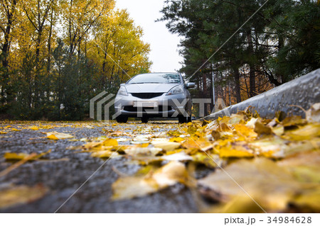 Japanese hatchback on autumn road Japanese hatchback on autumn road 34984628