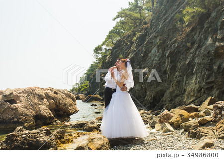 Just married couple embraced Just married couple embraced 34986800