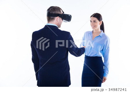 Nice friendly man greeting his colleague 34987241