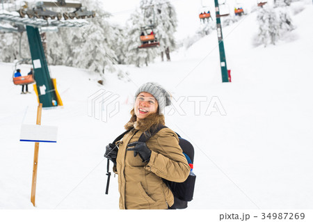Woman winter hiking. Beautiful young caucasian 34987269