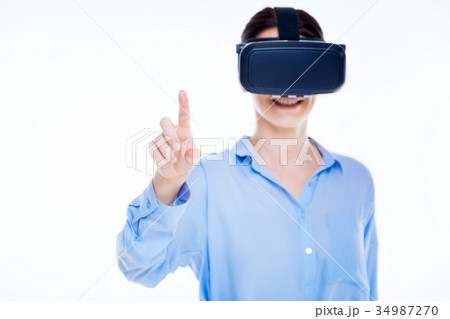 Happy delighted woman using virtual technologies Happy delighted woman using virtual technologies 34987270