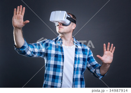 Nice adult man enjoying alternative reality Nice adult man enjoying alternative reality 34987914