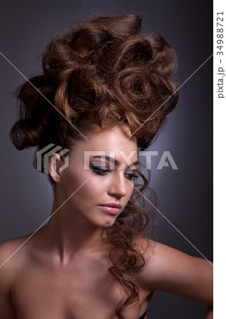 Portrait of a beautiful girl with a creative high hairstyle and Portrait of a beautiful girl with a creative high hairstyle and 34988721