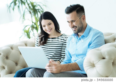 Friendly colleagues working together indoors Friendly colleagues working together indoors 34988880