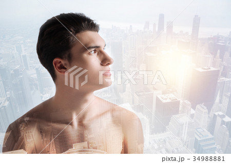 Thoughtful boy looking away in urban surrounding Thoughtful boy looking away in urban surrounding 34988881