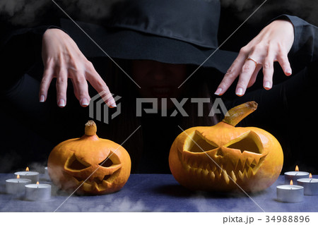 Halloween Witch with a magic Pumpkin. Halloween Witch with a magic Pumpkin. 34988896