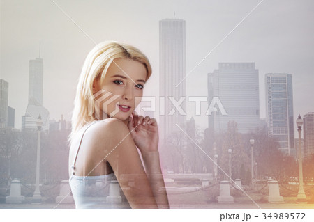 Lovely model touching her face with a finger Lovely model touching her face with a finger 34989572