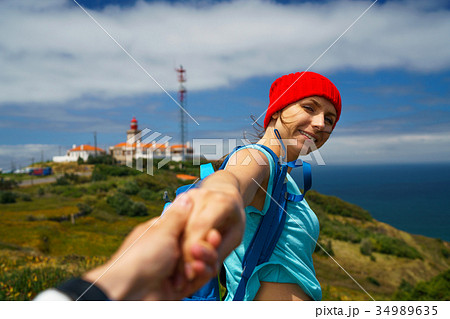 Follow me - woman pulling guy's hand Follow me - woman pulling guy's hand 34989635