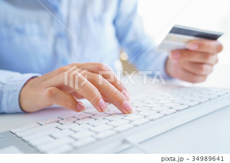 Woman using a credit card for online payments. The concept of on Woman using a credit card for online payments. The concept of on 34989641