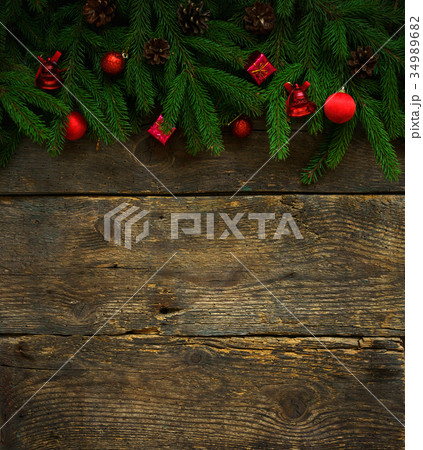 Christmas tree branches with christmas decorations Christmas tree branches with christmas decorations 34989682