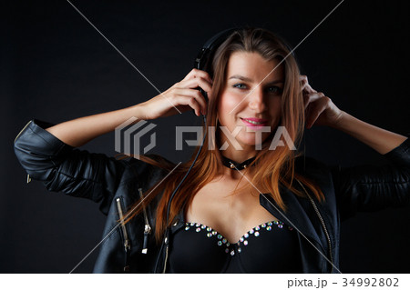Picture of beautiful girl in headphones with Picture of beautiful girl in headphones with 34992802