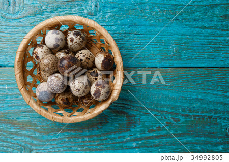 Picture of quail eggs in straw basket Picture of quail eggs in straw basket 34992805